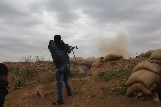 YPG fighters in action during an ISIS attack on Haj Ismail village, April, 2014
